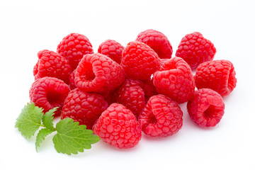 Ripe red raspberries isolated on white background.