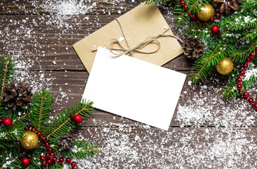 Fototapeta na wymiar christmas background with blank white greeting card