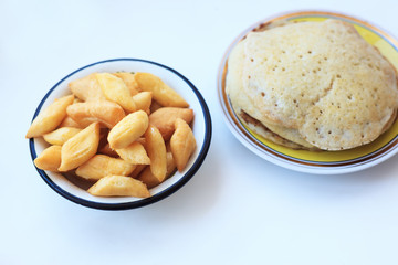 Pastries and pancakes on a white table