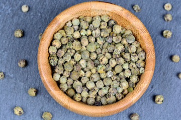 Above bowl with green peppercorns