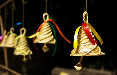 Bell made out of straw. Wicker solomyany bell hanging on the str