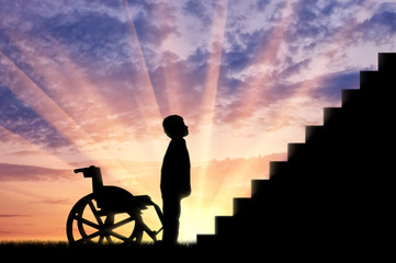 Disabled child standing in front of stairs