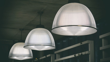 street lights, large bulb headlamps in the outdoor cafe