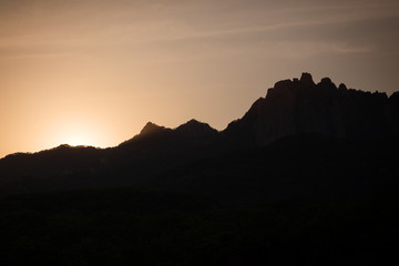Naklejka premium Sunset and silhouette of mountain peaks at the Bukhansan National Park in Seoul, South Korea. Copy space.