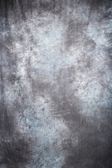 Fototapeta na wymiar gray fabric artistic background with simulated blurred ink.
