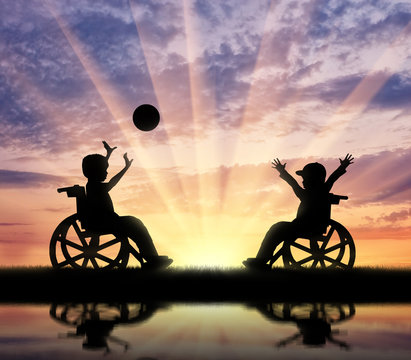 Happy children with disabilities play ball and reflection in river