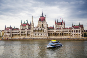 Fototapeta premium Danube_ pleasure boat and Hungarian Parliament
