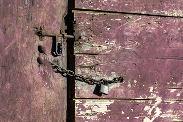 Latch and chain on a barn door -- color © jackienix