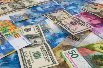 Obraz na płótnie Canvas USD and CHF banknotes as background