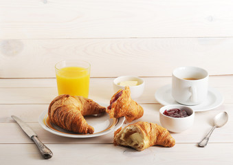 French Breakfast - croissant, jam, butter, orange juice and coff