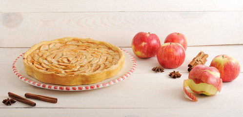 Apple pie and ingredients - apples and cinnamon