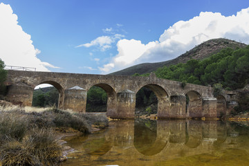 Fototapeta premium Roman Bridge in Odiel River, Huelva, Andalusia, Spain