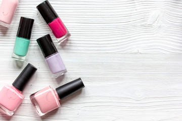 Obraz premium group of nail polish on wooden background top view