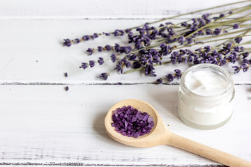organic cosmetics with lavender on wooden background