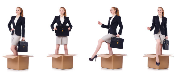 Businesswoman with boxes isolated on white