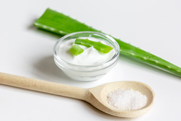 extract from aloe vera in glass bottle and cream macro