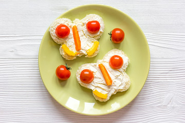 kid breakfast butterfly sandwiches top view on wooden background