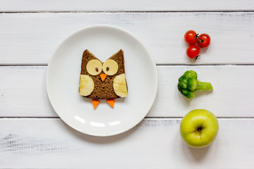 kids menu owl shaped sandwich with vegetables and fruits