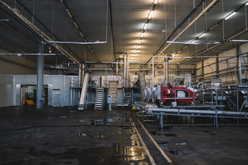 Industrial machinery interiors. Huge production hall of factory for freezing, selecting and keeping of deep frozen food.