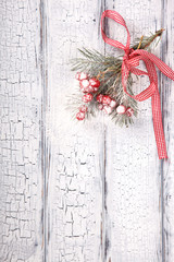 Christmas White Wooden  Background with crackling effect and  Fir Branch,of Cranberry.Winter Holidays Concept. top view. Copy space. selective focus.
