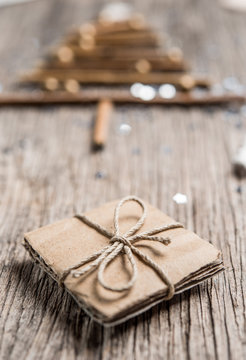 Handmade gift box on rustic wooden background