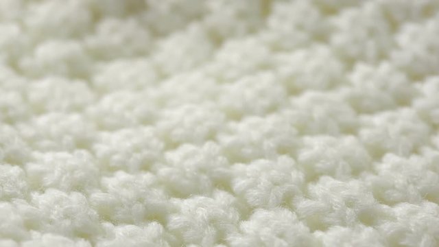 white knitted wool texture. use as background. close-up