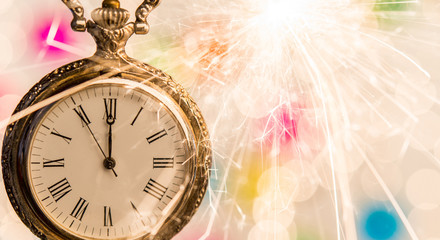 New year clock counting down and sparkler