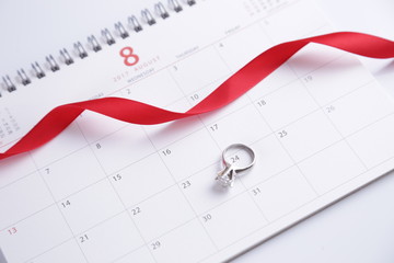 wedding ring and calendar