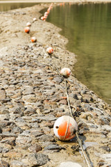 Old buoy on bubble in the coastal area