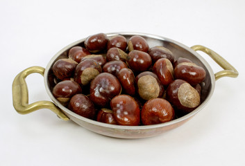 Chestnuts in Copper Pan Ready For Roasting