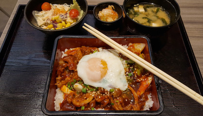 Stir fried pork with kimchi and egg onsen on the rice, bento set