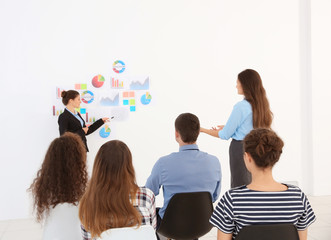 Business trainer talking with one of her learners