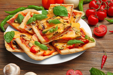 Delicious pizza slices on plate