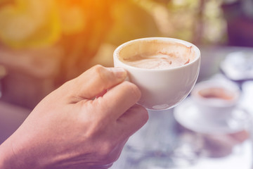 cup of coffee in the hands