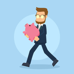 businessman walking carrying piggybank