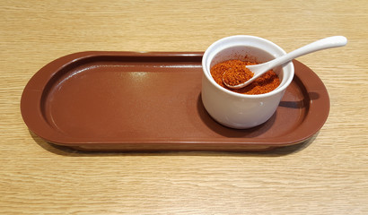 Paprika or cayenne pepper in the ceramic cup
