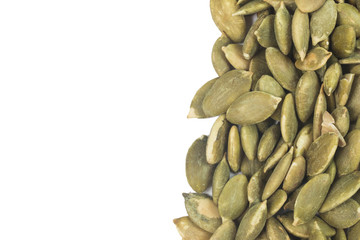 Dried pumpkin seeds isolate on white
