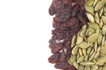 Dried raisins and Dried pumpkin seeds isolate on white
