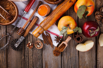 Baking Background. Ingredients  for baking Apple Pie  - apples,spices ,flour,  rolling pin, eggs, egg yolks, butter served.Vintage style.selective focus.Top view. Copy space.