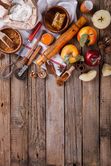 Baking Background. Ingredients  for baking Apple Pie  - apples,spices ,flour,  rolling pin, eggs, egg yolks, butter served.Vintage style.selective focus.Top view. Copy space.