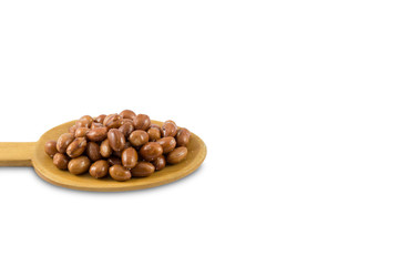 Salted peanut on wooden spoon isolated on white background