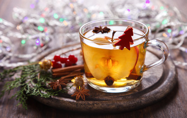 Apple Cider Drink,Juice,Cider with Spices ,Cinnamon sticks and fresh Apples.Hot drink for Autumn and Winter Christmas evenings.selective focus.