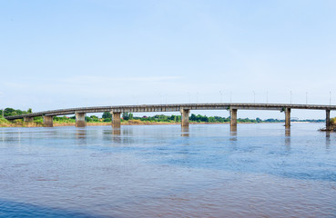 A concrete bridge passing over the river at  Thailand