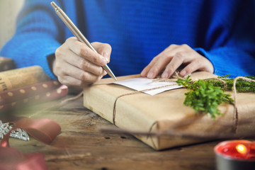 Hand writing on christmas presents.