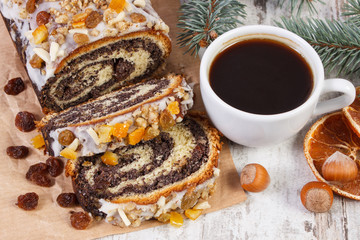 Poppy seeds cake, cup of coffee and spruce branches, dessert for Christmas