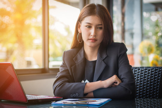 Businesswoman thinking about business profits quarter of year at office