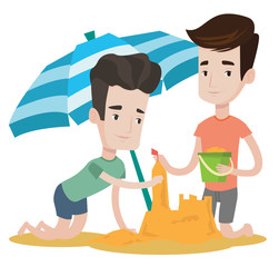Male friends building sandcastle.