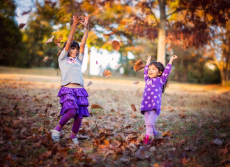 Children throwing leaves