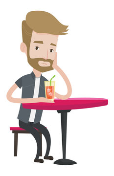 Man drinking cocktail at the bar.
