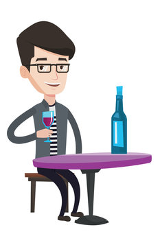 Man drinking wine at restaurant.